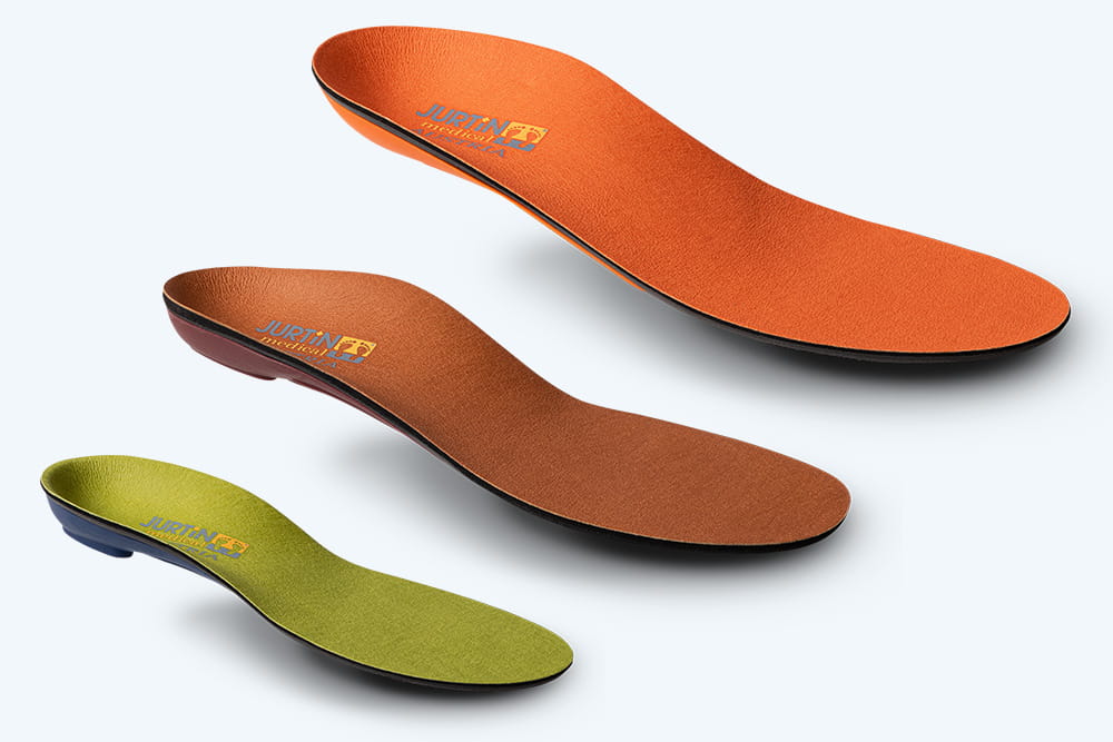 Drei Einlagen vom Hersteller Jurtin übereinander in orange, braun und grün