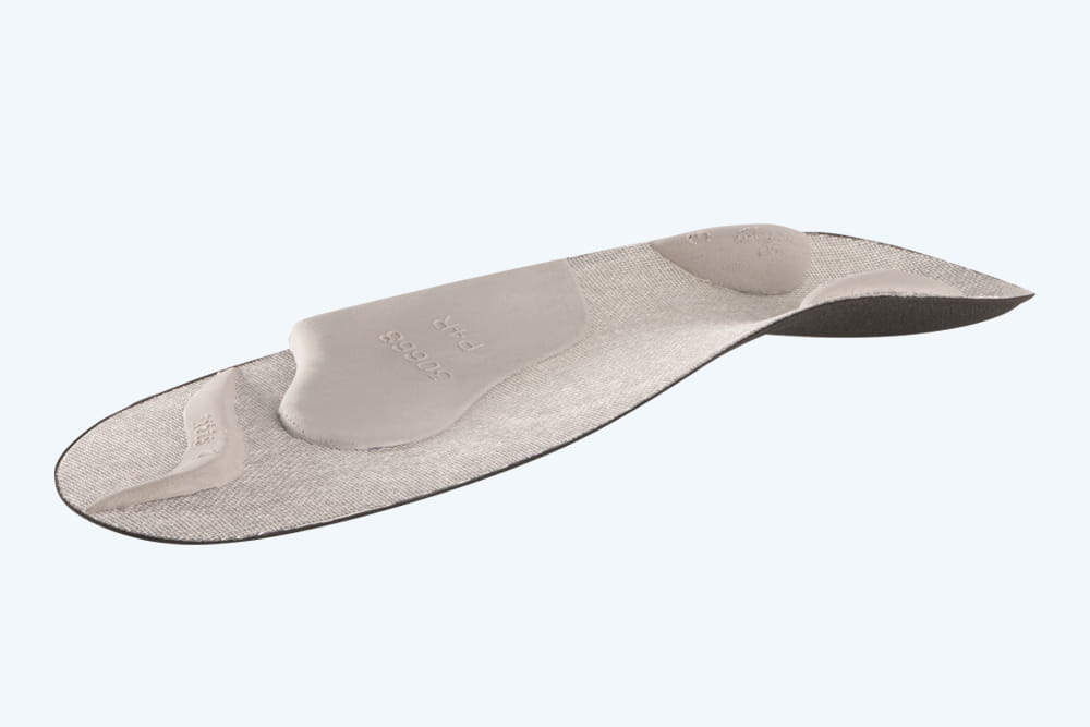 Eine freigestellte graue Tonus Control Einlage von Perpedes.